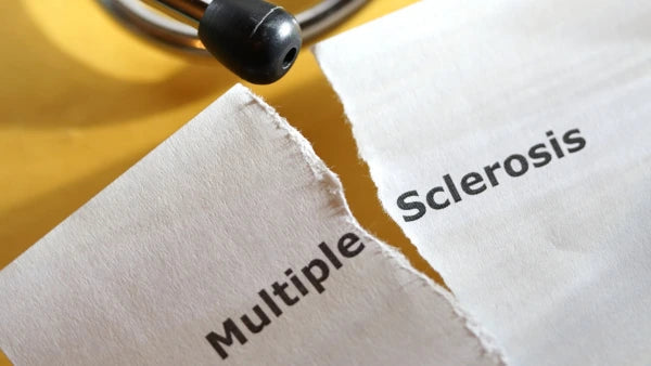 an image of a paper with words "Multiple Sclerosis" torn in the middle.