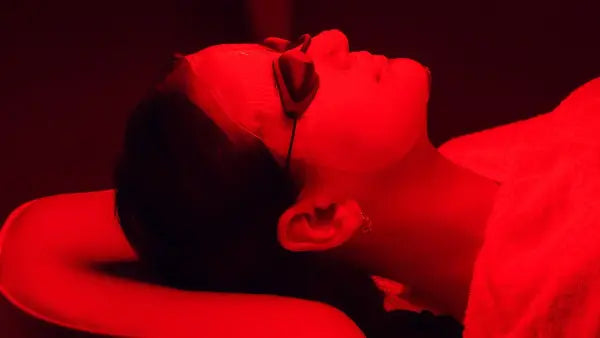 Red light on the face of a woman